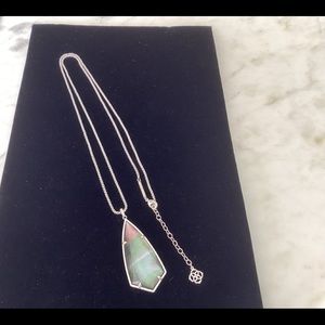 Kendra Scott black Mother of Pearl pendant with 30” rolo style chain.
